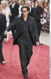 Action JOHNNY DEPP dons a swanky three piece pinstripe suit as he attended the 'Public Enemies' premiere