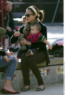 Actress JESSICA ALBA has bottle time at playground with HONOR