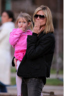 Top model HEIDI KLUM in neon sneakers hits the playground with kids