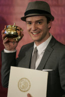 Justin Timberlake holds Harvard Hasty Pudding Man of the Year award.