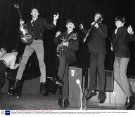 The Beatles Rehearsing For Appearance On The Royal Variety Performance. November 1963. Paul Mccartney George Harrison John Lennon And Ringo Starr Are All On Stage Jumping In The Air. 1963