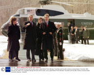 U.S. President George W. Bush and his wife, Laura,  greet British Prime Minister Tony Blair and his wife, Cherie, at Camp David. Thurmont, MD - February 23, 2001