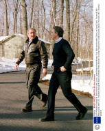 U.S. President George W. Bush and his wife, Laura,  greet British Prime Minister Tony Blair and his wife, Cherie, at Camp David. Thurmont, MD - February 23, 2001