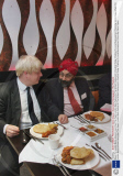 Mayor For London Boris Johnson Launches This Years London Mela Festival At The Brilliant Restaurant In Southall Today. Chatting To Local Businessmen Picture By Glenn Copus