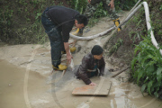 91-year-old grandmother trapped in muddy pool for 10 hours, Chongqing, China - 17 Apr 2010