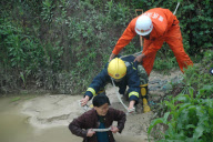 91-year-old grandmother trapped in muddy pool for 10 hours, Chongqing, China - 17 Apr 2010