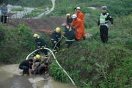 91-year-old grandmother trapped in muddy pool for 10 hours, Chongqing, China - 17 Apr 2010