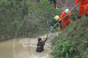91-year-old grandmother trapped in muddy pool for 10 hours, Chongqing, China - 17 Apr 2010
