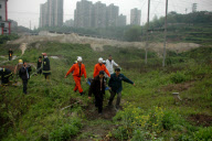 91-year-old grandmother trapped in muddy pool for 10 hours, Chongqing, China - 17 Apr 2010