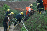 91-year-old grandmother trapped in muddy pool for 10 hours, Chongqing, China - 17 Apr 2010