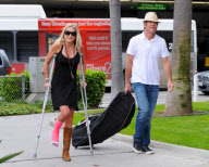 Dennis Quaid Arrives with Broken Footed Wife at LAX