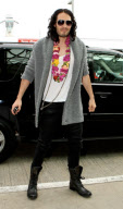 RUSSELL BRAND FLIES OUT OF LA