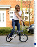 Chantelle Houghton constructing and riding her folding bicycle, Brentwood, Essex, Britain - 28 Nov 2007