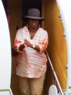 EXCLUSIVE - Oprah flies private while audience winners take commercial in Australia
