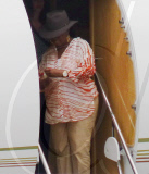 EXCLUSIVE - Oprah flies private while audience winners take commercial in Australia