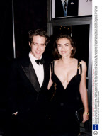 Actor Hugh Grant With Elizabeth Hurley. The Black Versace Outfit Was Worn By Miss Hurley Then 29 As She Accompanied Ex-boyfriend Hugh Grant To The 1994 Premiere Of His Film Four Weddings And A Funeral.