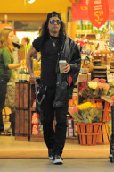 *EXCLUSIVE* Slash grabs a Coffee To Go with his Wife