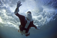 Underwater wave Father Christmas pictures by Mark Tipple, Bondi Beach, Sydney, Australia - 16 Dec 2010