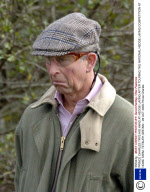 PRINCE CHARLES TRYS HIS HAND AT HEDGE LAYING AFTER TOURING THE NATIONAL HEDGE LAYING COMPETITION AT HOME FARM, TETBURY, BRITAIN - 29 OCT 2005