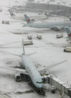 Snow Covered Air Canada Planes sit at their Gates at Vancouver International Airport, Richmond, Canada  - 24 Dec 2008