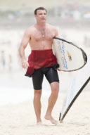 Liev Schreiber taking Surfing Lessons at Bondi Beach