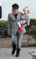 LISA MARIE PRESLEY and MICHAEL LOCKWOOD arriving at LAX airport with their adorable twin girls