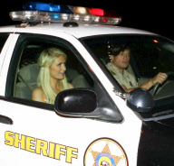Paris Hilton in a police car