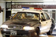 Paris Hilton in a police car