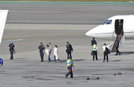 Katie Holmes Touches Down With Suri 