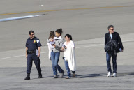Katie Holmes Touches Down With Suri 