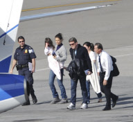 Katie Holmes Touches Down With Suri 