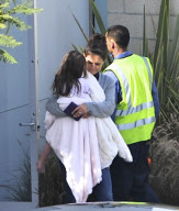 Katie Holmes Touches Down With Suri 
