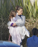 Katie Holmes Touches Down With Suri 