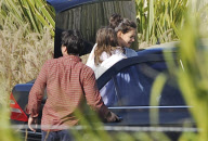 Katie Holmes Touches Down With Suri 