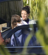 Katie Holmes Touches Down With Suri 