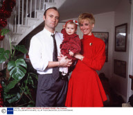 PHIL COLLINS WITH HIS WIFE, JILL AT THEIR DAUGHTER LILY'S CHRISTENING