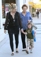 SHARON STONE takes her adopted son QUINN KELLY and her mother DOROTHY STONE shopping