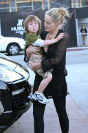 SHARON STONE takes her adopted son QUINN KELLY and her mother DOROTHY STONE shopping