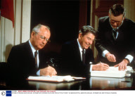 RONALD REAGAN AND MIKHAIL GORBACHEV SIGNING NUCLEAR REDUCTION TREATY IN WASHINGTON, AMERICA
