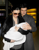 Orlando Bloom, Miranda Kerr and their baby boy Flynn arrive in Paris.