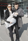 Orlando Bloom, Miranda Kerr and their baby boy Flynn arrive in Paris.