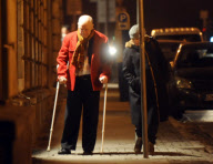 John Malkovich on crutches after breaking his leg