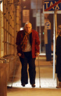 John Malkovich on crutches after breaking his leg