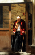 John Malkovich on crutches after breaking his leg