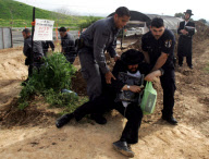 Israeli police arresting ultra Orthodox Jews during a protest against digging up tombs, Haifa, Israel - 06 Mar 2011