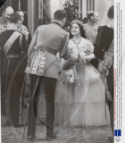 King George Vi (died 6/2/52) And Queen Elizabeth (queen Mother) (died 30/3/02) March 1939 The Queen In White Crinoline Powdered With Gold Sequins Handed Her Fur Wrap To An Officer As She Arrived At Covent Garden Last Night. With The King Queen Mary A