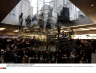 NY: CROWDS WAIT IN RAIN FOR RELEASE OF iPAD II