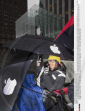 NY: CROWDS WAIT IN RAIN FOR RELEASE OF iPAD II