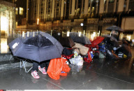 NY: APPLE FANS WAIT IN THE RAIN FOR IPAD 2 RELEASE