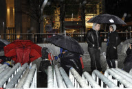 NY: APPLE FANS WAIT IN THE RAIN FOR IPAD 2 RELEASE